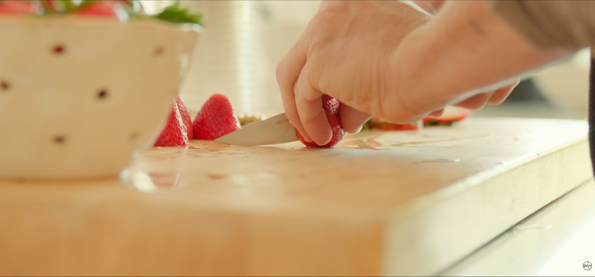 Slicing strawberries by hand